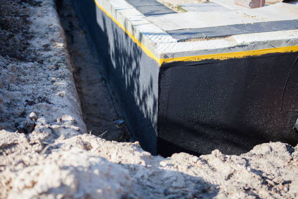 Professional Basement Waterproofing technician working in Worthington, MN